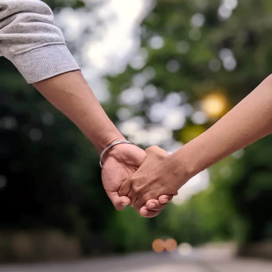 Vishnu and Arsha holding hands